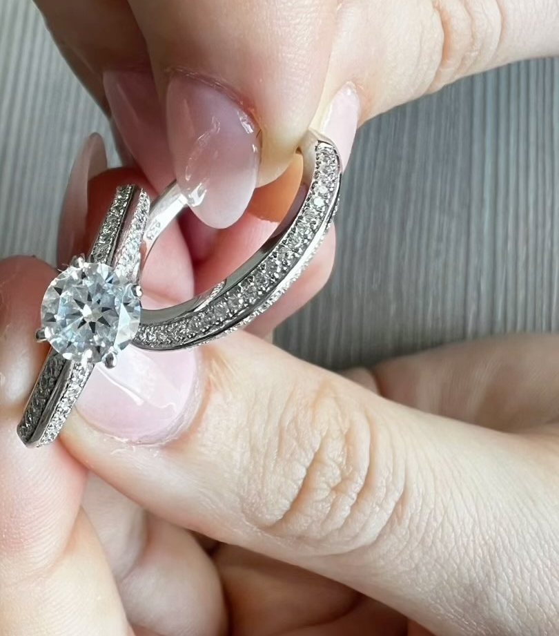 Diamond Earrings being held